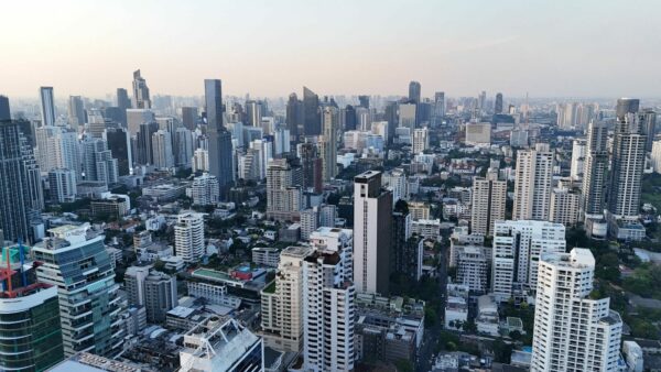 A breathtaking aerial view of the bustling Bangkok skyline at dusk highlighting modern skyscrapers.