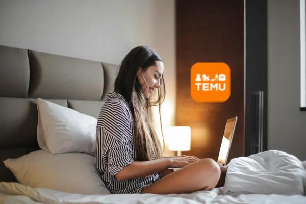 Woman sitting in bed, shopping online with Temu